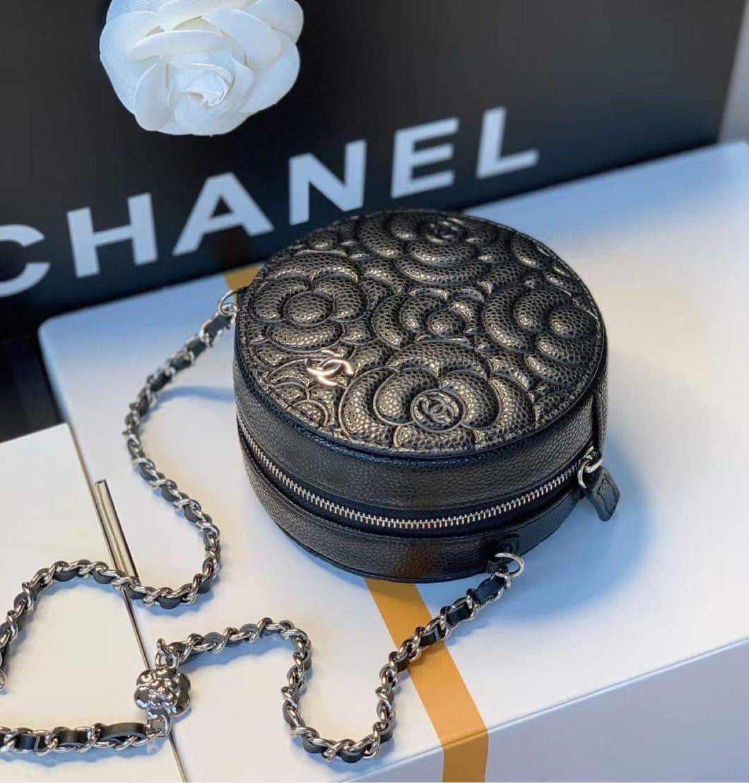 Channel round clutch bag with chain .